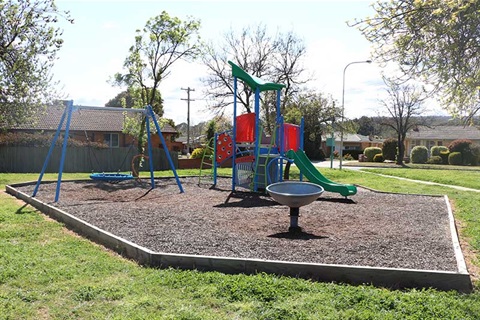 Dane Park showing basket swing, slide and climbing frame.